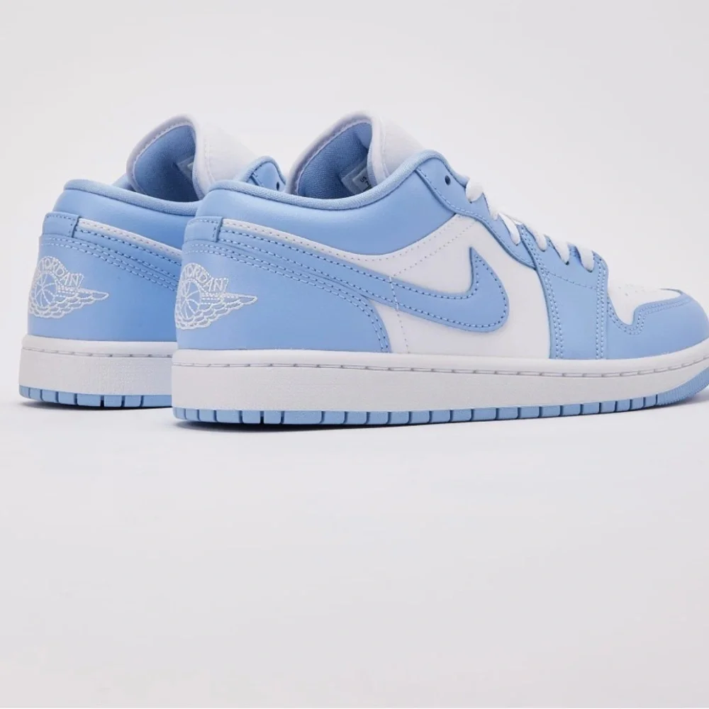 Nike - Women's Air Jordan Retro 1 Low Sneakers. White and baby blue.